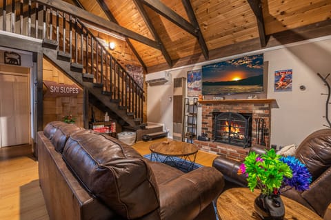 Enjoy your favorite movie on the 65" inch fully loaded TV with wood burning fire