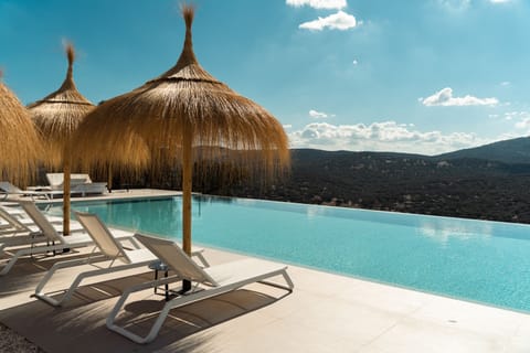 Outdoor pool, open 9:00 AM to 9:00 PM, pool umbrellas, sun loungers