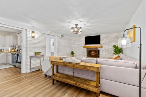 A 55" smart TV is perfect for relaxing on the large sectional.