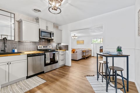 You'll love the fully stocked kitchen and high top for additional seating.