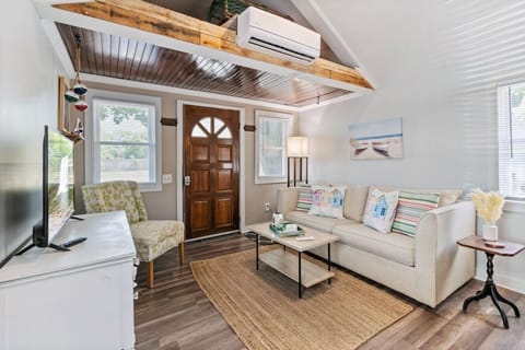 Front door opens to cozy front room with TV. Couch pulls out for sleeping if needed.