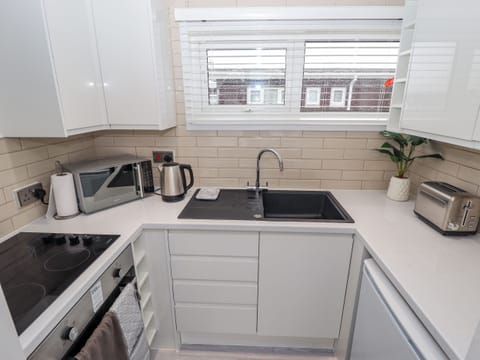 Fridge, electric kettle, toaster, cookware/dishes/utensils