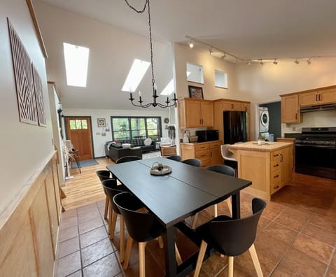 Open Dining (for 8), kitchen, and living rooms.