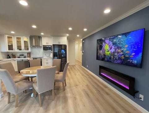 A 70" smart TV with a wall mounted fireplace