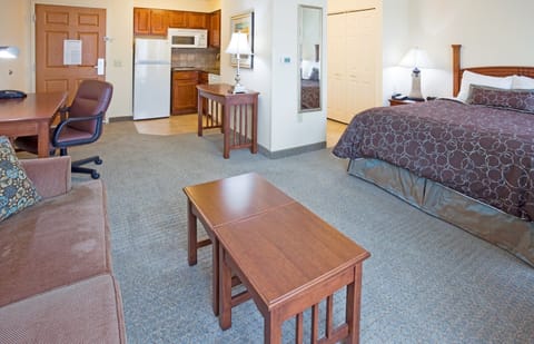 Bright queen studio suite with modern furnishings.