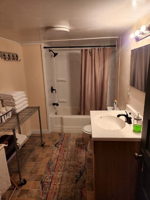 Spacious  bathroom with extra towels  for soaking.