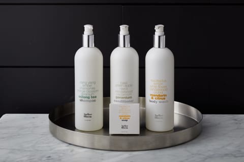 Designer toiletries, hair dryer, bathrobes, towels