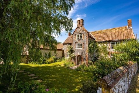 School House, Burnham Thorpe: A large detached, characterful flint and brick rural retreat with outdoor pool