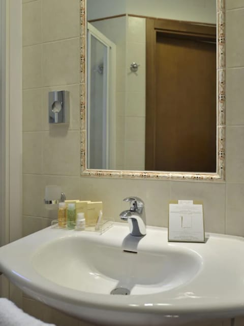 Designer toiletries, hair dryer, slippers, bidet