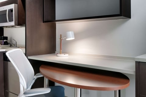 Desk, laptop workspace, blackout drapes, iron/ironing board