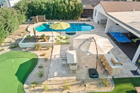 Soak up the sun, take a dip, or work on your short game right in the backyard.