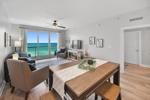 Wake to stunning turquoise waters through floor-to-ceiling windows in your bright, coastal-styled living space with ocean views.