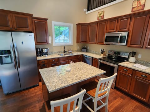 Kitchen with modern appliances and fully stocked with essentials