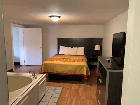 Desk, laptop workspace, blackout drapes, iron/ironing board