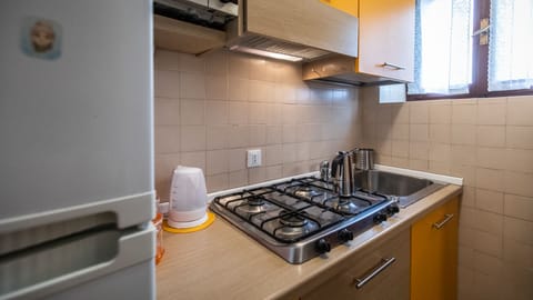 Family Studio (0 Bedroom) | Private kitchen | Microwave, oven, dining tables