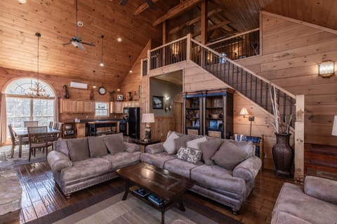 Main living room with stairs to loft