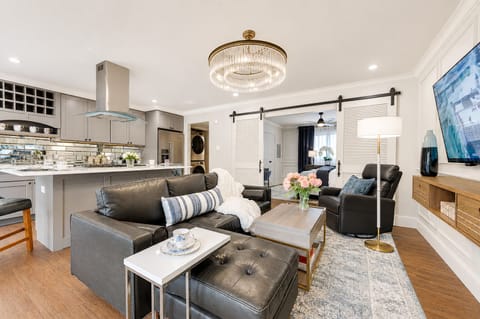 Relax on the comfy leather sectional or unwind in the recliner, both offering great views of the large smart TV—perfect for catching up on your favorite shows.