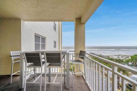 Covered balcony w/ seating, ideal for morning coffee or unwinding while enjoying fresh air.