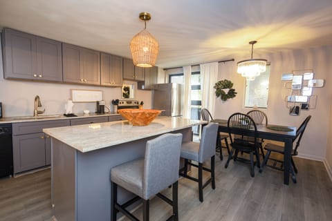 Spacious open floor plan with a large kitchen island, perfect for cooking, dinning and socializing 
