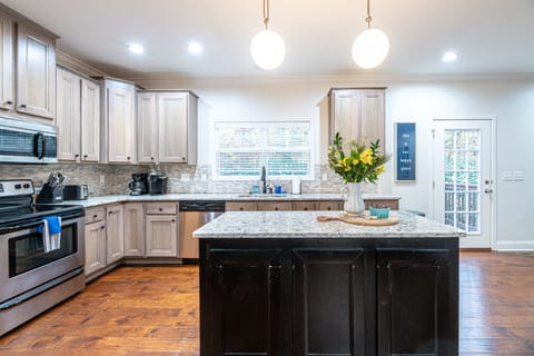 Kitchen comes with full sized appliances and all you need to enjoy a meal together at home.