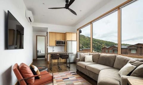 View of the living room and kitchenette area on the second floor of the home