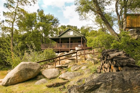 River Willow Cabin, a handsome 1950's cabin perched upon river boulders