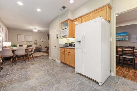 A small dining table is attached to the kitchen. Living room is also within sight. Great room!