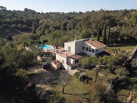 Finca "Sa Sigona" total view with pool and parking area in front in spring time