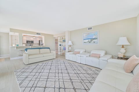 VSC801 - Comfortable seating and flat screen TV in the living. Sliding doors open up to the corner balcony with Gulf view