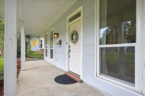 Large front porch entrance, one small step to enter the home.