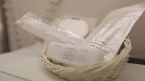 Combined shower/tub, free toiletries, hair dryer, slippers