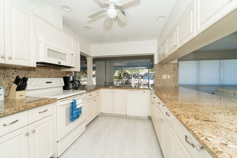 Wide open kitchen with extra seating bar stools