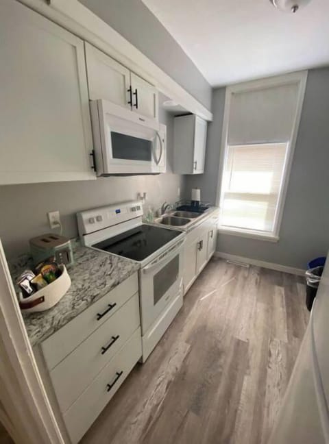 Kitchen with microwave, full size fridge, stove, toaster and Keurig coffee maker