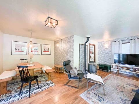 The dining and living area with an open concept and a beautiful pellet stove to keep you warm