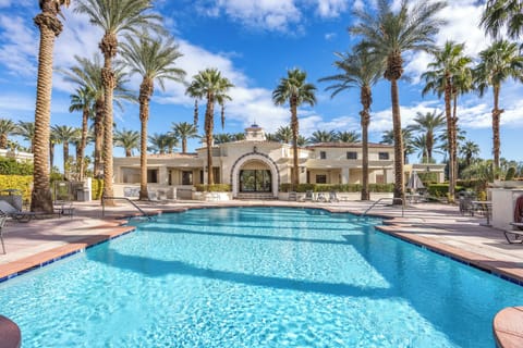 Sunny days by the pool with palm trees and mountain backdrop feel magical.