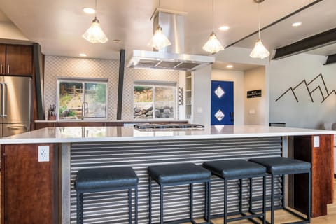 There is seating for four at the kitchen island