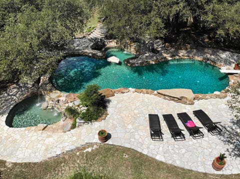 Absolutely amazing country club style 12' pool with a diving board and BBQ area