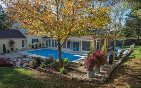 Large pool, fireplace, and fenced in yard.