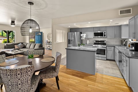 Open living room, kitchen, and dining layout