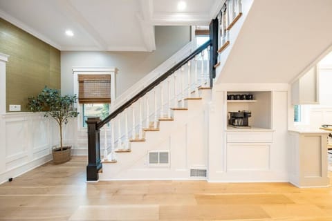 Coffee bar and a 100 year old staircase ready to escort you to a modern, charming second floor.