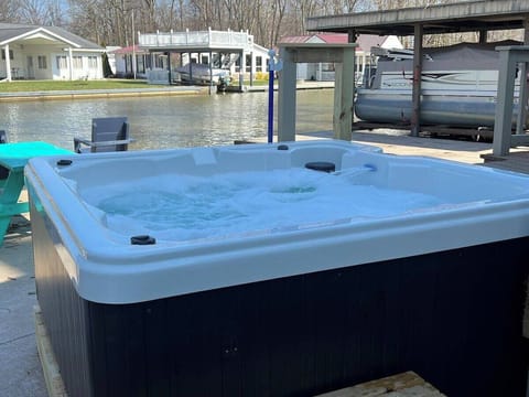 6 Person hot tub located conveniently off the deck just outside the back door. 