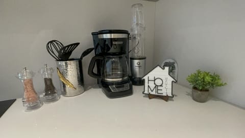 COFFEE MAKER
modern kitchen with fridge, washer/dryer, microwave, oven and stove