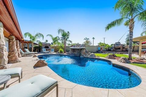Backyard Overview - pool, outdoor bar, outdoor kitchen, fireplace