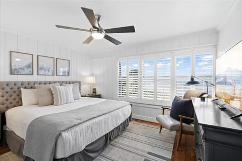 Bright and airy bedroom with scenic window views and cozy decor