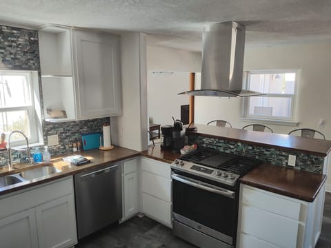 Kitchen with gas stove, dishwasher and drip coffee machine and Keurig
