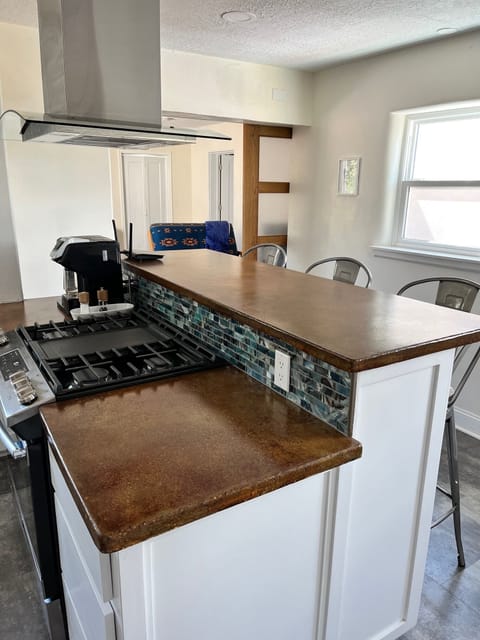 Kitchen with walkway to TV area and back bedroom