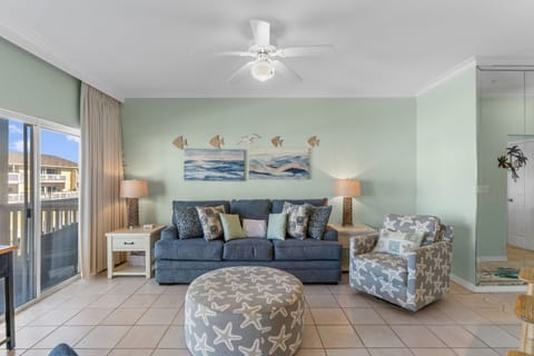 Relax in your coastal-themed living room with ocean-inspired décor and comfortable seating that makes every moment feel like a beachside retreat.