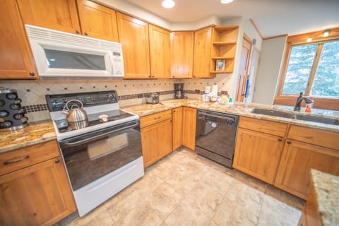 Bright kitchen with granite countertops