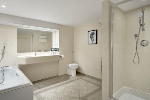 Suite, 1 King Bed with Sofa bed | Bathroom | Combined shower/tub, free toiletries, hair dryer, towels