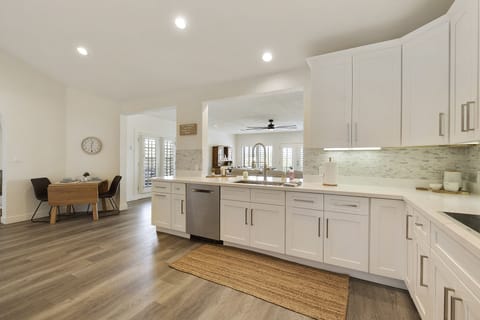 Large kitchen looking into the family room.